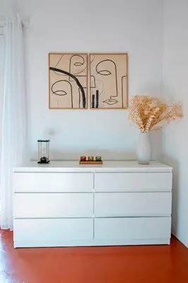 a white dresser with a vase on top of it at Charmant Appartement 2P au Cœur du Vieux Nice in Nice
