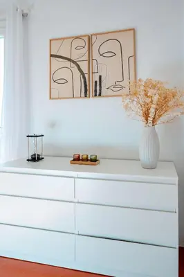 a white dresser with a vase on top of it at Charmant Appartement 2P au Cœur du Vieux Nice in Nice