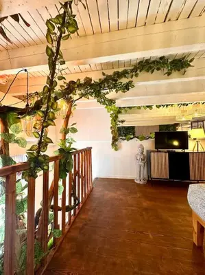 a living room with plants on the walls at Jungle avec Jaccuzi au coeur de Nice in Nice
