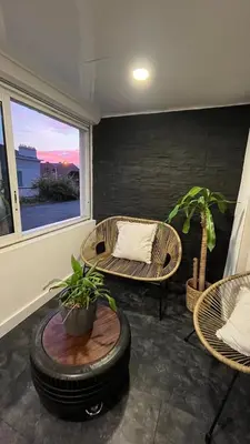 a living room with chairs and tables and a window at Appartement au port de Nice, proche des plages in Nice