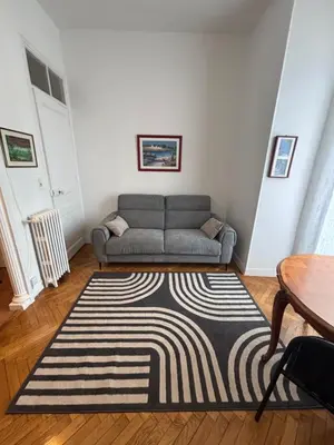 a living room with a couch and a table at Coeur de Nice - Plage et Centre in Nice