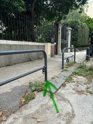 a green ribbon is tied to a metal rail at Coeur de Nice - Plage et Centre in Nice