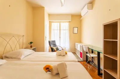 a bedroom with a dog laying on a bed at LE CAPITOL 2 AP4421 By Riviera Holiday Homes in Nice