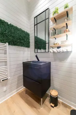 a bathroom with a black sink and a window at Riviera Bliss in Nice