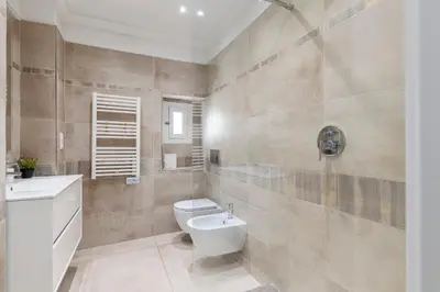 a bathroom with a toilet and a sink at Center 2 min walk to beach quiet sunny balcony in Nice