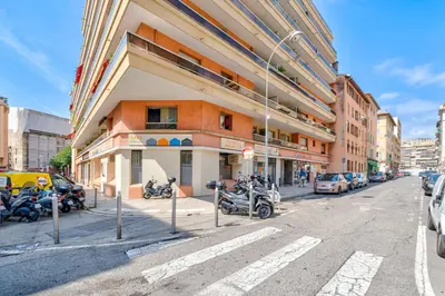 a building with motorcycles parked in front of it on a street at Near old town and apartment fully renovated in Nice