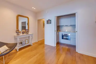 a living room with a fireplace and a mirror at LE 3 PROMENADE AP4424 By Riviera Holiday Homes in Nice