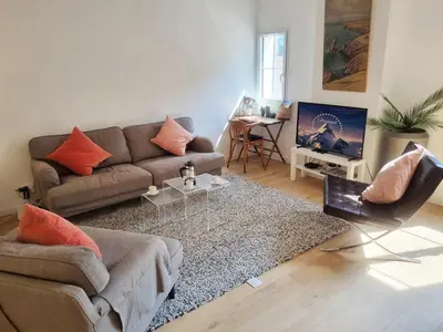 a living room with a couch and a table at 