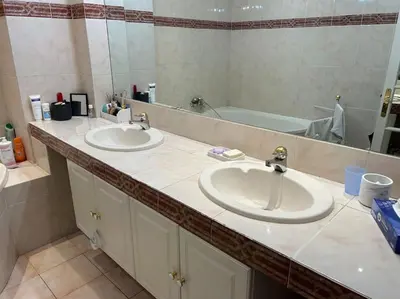 a bathroom with two sinks and a large mirror at Le Dante CLIM Balcon in Nice