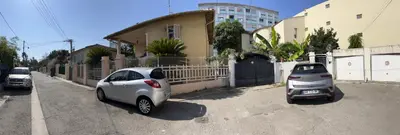 two cars parked on the side of a street at Villa CALIFORNIA in Nice