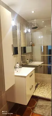 a bathroom with a sink and a shower at Villa CALIFORNIA in Nice