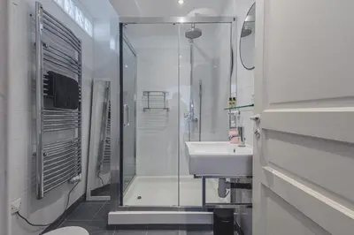a bathroom with a glass shower and a sink at Bohème-Chic au cœur du VIEUX NICE #Lovely in Nice
