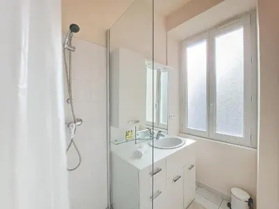 a white bathroom with a sink and a shower at Nestor&Jeeves - PALAIS DU PORT - Balcony - Port Place du Pin in Nice