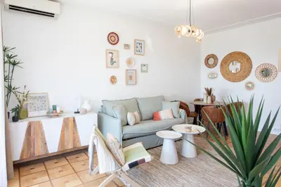 a living room with a couch and a table at L54 1BDR Promenade Sea View AC & Balcony in Nice