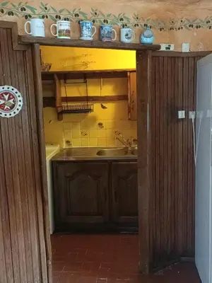 an open door to a kitchen with a sink at Maison dans l'arrière pays niçois entre mer et montagne in Tourrette-Levens