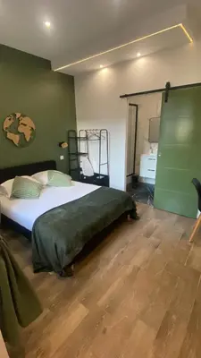 a bedroom with a large bed in a room at Studio Californie beach in Nice