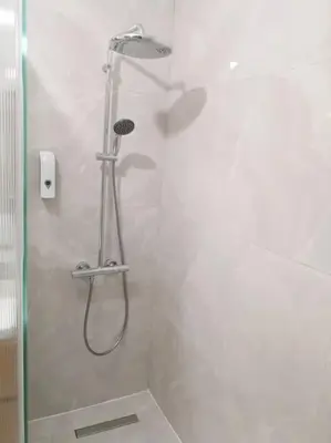 a shower with a shower head in a bathroom at Chez L'Hadriana, 2x AC clim Wi-Fi,newly renovated in Nice