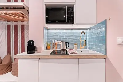 a kitchen with a sink and a microwave at Nice Renting - SPITALIERI - Chic & Cosy Art Deco Nest Nice Étoile in Nice