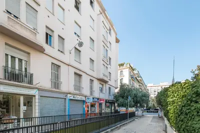 an empty street in a city with buildings at Nice Renting - SPITALIERI - Chic & Cosy Art Deco Nest Nice Étoile in Nice