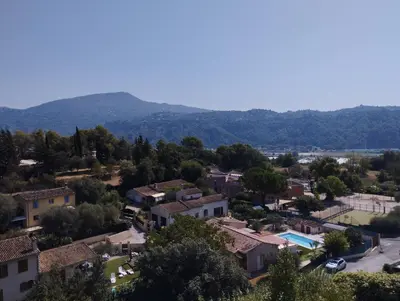 an aerial view of a small town with houses at entre terre et mer 3 pièces in Gattières