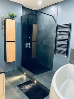 a bathroom with a glass shower and a sink at Luxueux appartement, Carré d'Or, Square Mozart in Nice
