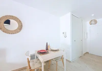 a white table and chairs in a room with a mirror at Nestor&Jeeves - KALLISTA - Central - Balcony in Nice