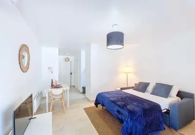 a bedroom with a bed and a table and a desk at Nestor&Jeeves - KALLISTA - Central - Balcony in Nice