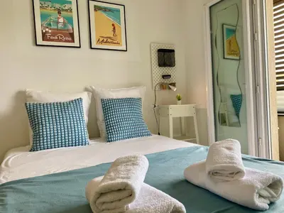 a bedroom with a bed with towels on it at Ma place au sud Nice 405 in Nice