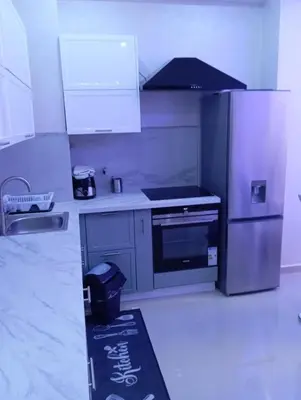 a kitchen with a stove and a refrigerator at Sea Front View - FRONT DE MER ET VUE PANORAMIQUE in Nice