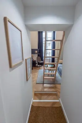 a view of a living room with a ladder and a chair at Charmant appartement rénové au cœur de Nice in Nice