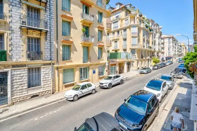 a city street with cars parked on the street at Studio hypercentre de Nice climatisé in Nice