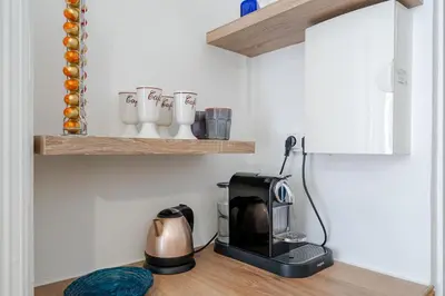 a kitchen with a toaster and a coffee maker on a counter at Studio hypercentre de Nice climatisé in Nice