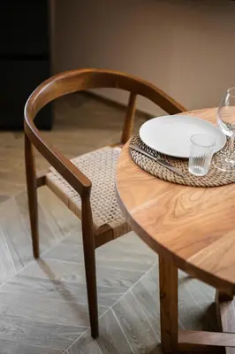 a wooden table with a wooden chair and a plate on it at La Suite Lascaris PORT of NICE #renovated in Nice