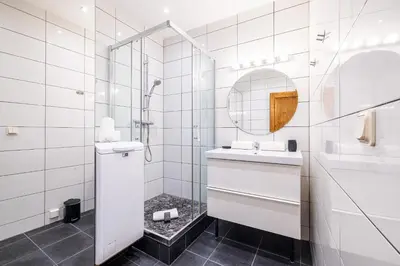 a white bathroom with a sink and a shower at 2 Bdr Heart Old Town Nice in Nice