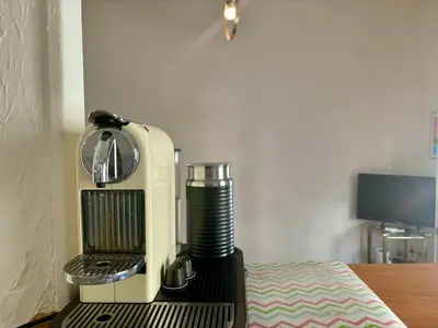 a coffee machine sitting on top of a table at Appartement Nice centre ville gare in Nice