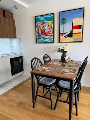a dining room with a table and chairs at Residence Butterfly in Nice