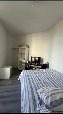 a bedroom with a bed and a television in it at Spacieux 4 couchage plein centre in Nice