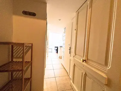 a hallway with a door and a tile floor at Cosy appart 4pers vieux Nice in Nice
