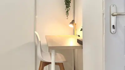 a small room with a desk and a chair at Central Studio - Bright & Modern - Private Terrace - AirCon - Near Train & Beach in Nice