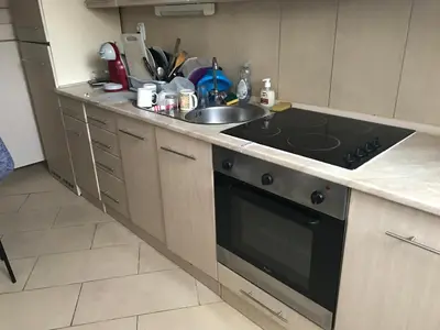 a kitchen with a stove and a sink at Chambre Nice hyper centre ville in Nice