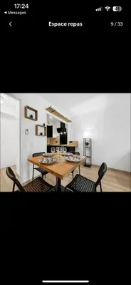 a dining room with a table and two chairs at Le Rieviera Bay-Parking-Jardin Pick up Airport in Saint-Laurent-du-Var