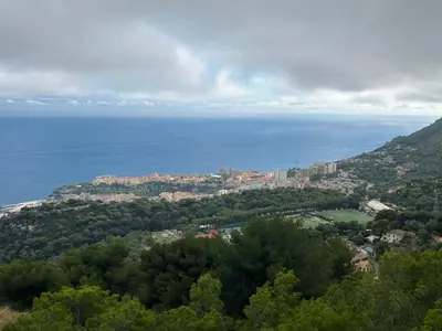 a view of a city and the ocean from a hill at Le Rieviera Bay-Parking-Jardin Pick up Airport in Saint-Laurent-du-Var