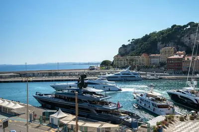 a bunch of boats are docked in a harbor at Sunlight Properties - Capitaine 54 - 1 Bedroom, stunning holiday rental apartment with balcony and port view in Nice