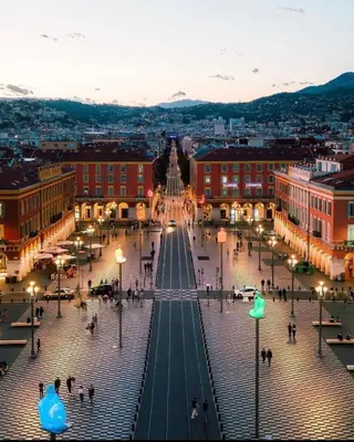 a view of a city street at night at Le Grand Palais de la Méditerranée Beach Access Apartments - Top Choice In Nice in Nice