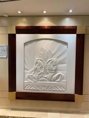 a wall with a sculpture on it in a building at Le Grand Palais de la Méditerranée Beach Access Apartments - Top Choice In Nice in Nice