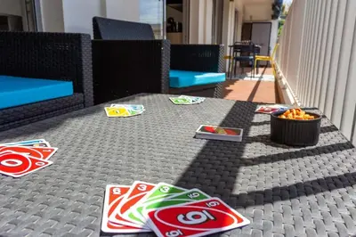 a table with coke and snacks on it at Le Mimosa - Calm - Spacious - 200m from the sea - Parking in Cagnes-sur-Mer