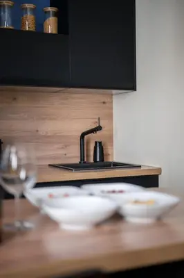 a kitchen counter with two white bowls and a sink at Raffinement en pleine ville in Nice
