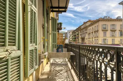 a balcony with green shutters on a building at New vieille ville cimiez Centre Nice in Nice