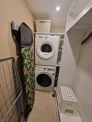 a small room with a washing machine and a washer at Charmant 2 pièces Centre Ville in Nice