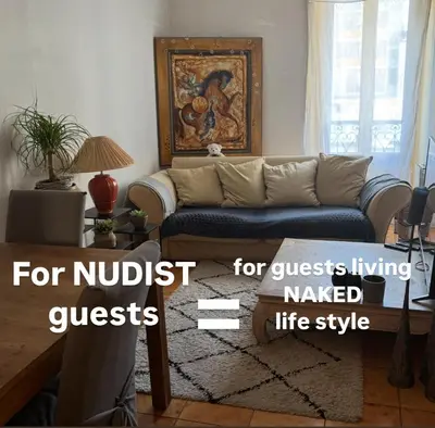 a living room with a couch and a table at Room for NUDISTS near Nice port in a shared apartment in Nice